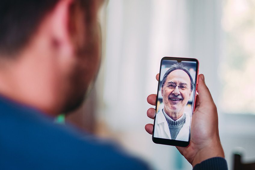 Man getting virtual care through his cell phone's video calling